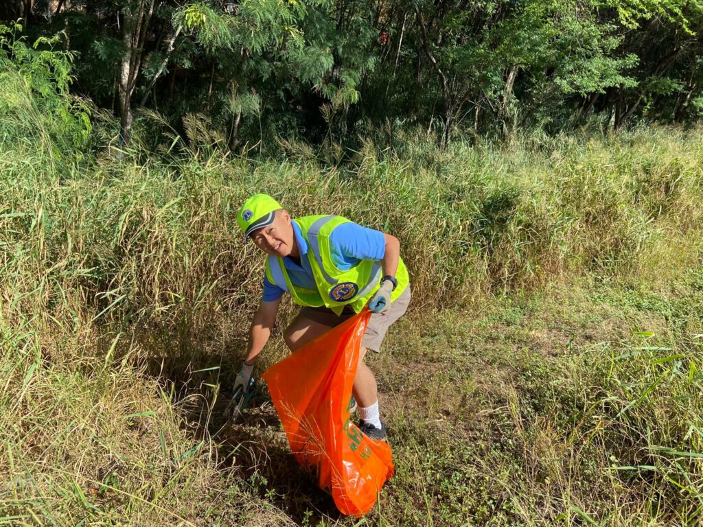 Lion picking up trash