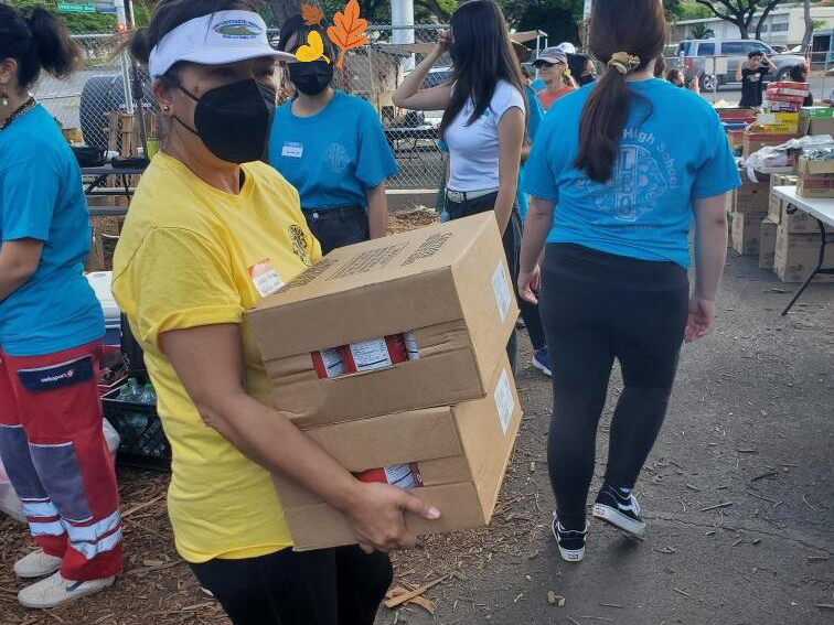 Lion Jackie carrying supplies